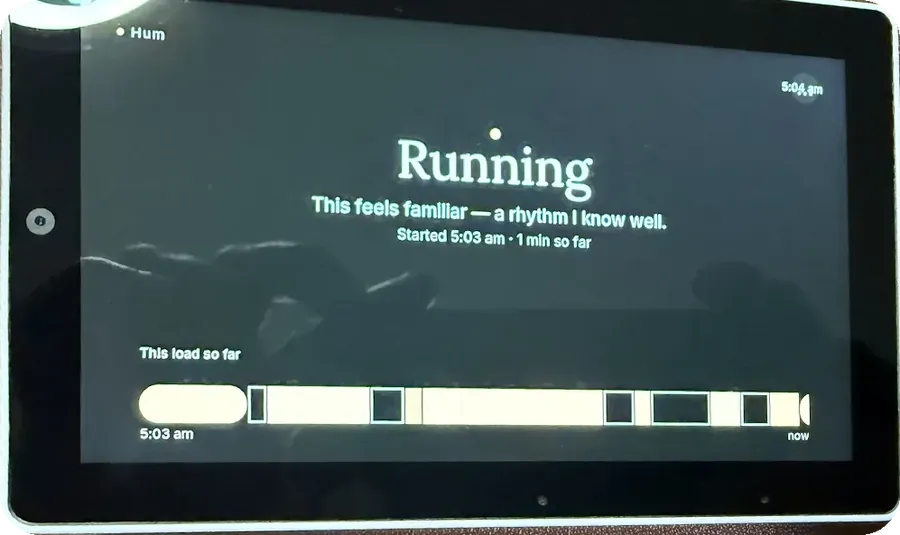 The device showing Hum running, reading: This feels familiar — a rhythm I know well, with a timeline of the load so far.